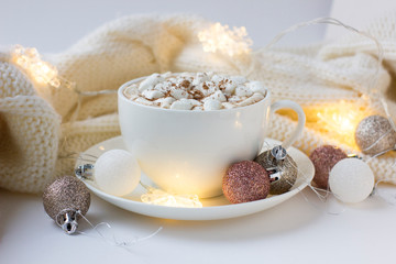 Christmas or New Year background with white cup of hot cocoa with marshmallows.