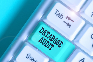 Writing note showing Database Audit. Business concept for auditing of data to assess its quality...