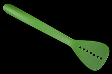 Plastic green skimmer on white