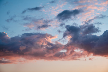 Naklejka na ściany i meble Clouds during sunset as a background.