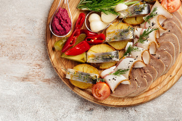 traditional vodka appetizer with herring and beef tongue