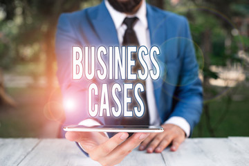 Conceptual hand writing showing Business Cases. Concept meaning undertaking on the basis of its...