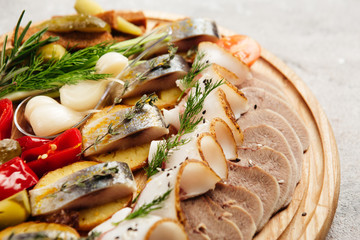 traditional vodka appetizer with herring and beef tongue