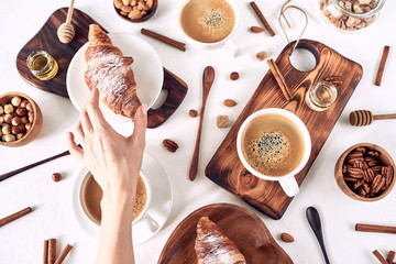 European breakfast, top view, coffee, croissants, honey, nuts, good morning concept