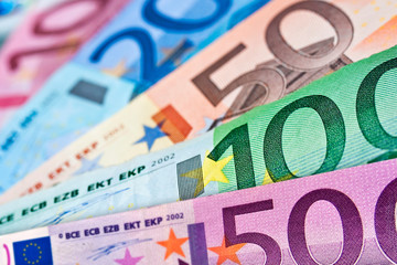 Close up of various euros banknotes, colorful money background, european currency cash concept