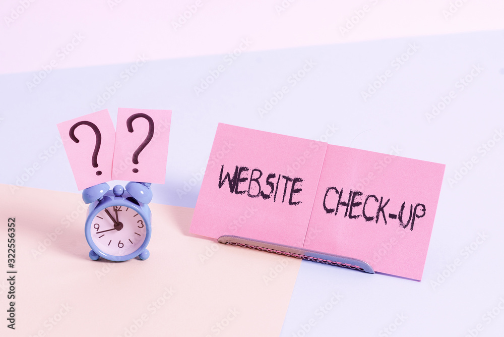 Fototapete Word writing text Website Check Up. Business photo showcasing an examination of a website to see if something is in order Mini size alarm clock beside a Paper sheet placed tilted on pastel backdrop