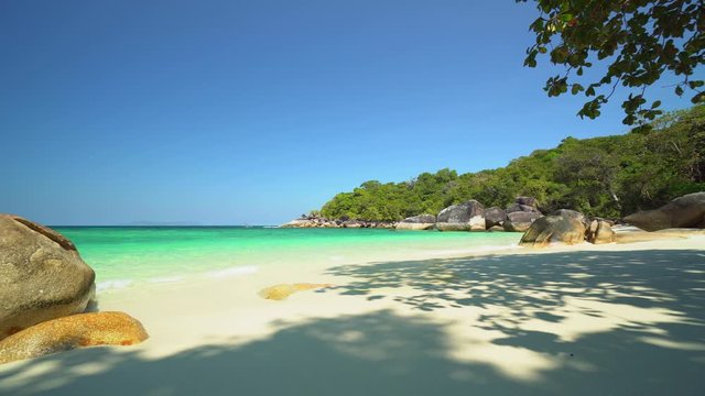 Aerial view of ocean waves, Beautiful tropical beach and rocky coastline and beautiful forest. Nyaung Oo Phee Island Myanmar