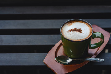Hot a cup of coffee mocha latte on iron table
