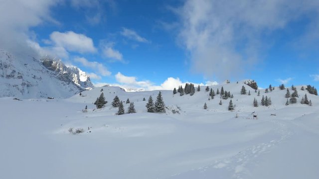 Amazing time lapse shot of a winter landscape in the snow covered Alps