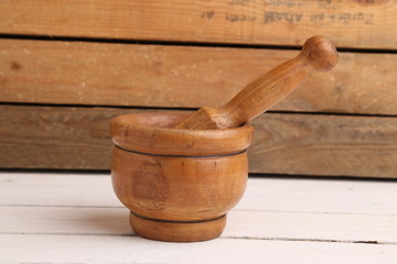 cooking wooden mortar in color background