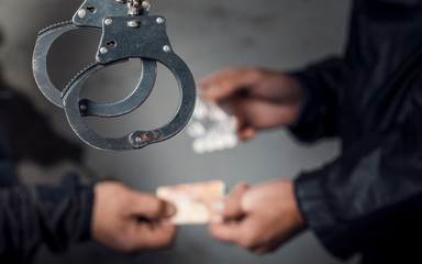 police officer and man arrested for drug possession