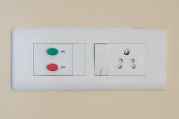 Modern modular switchboard with on/off switch, 3 pin socket and fan regulator.