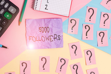 Text sign showing 5000 Followers. Business photo showcasing number of individuals who follows someone in Instagram Mathematics stuff and writing equipment above pastel colours background