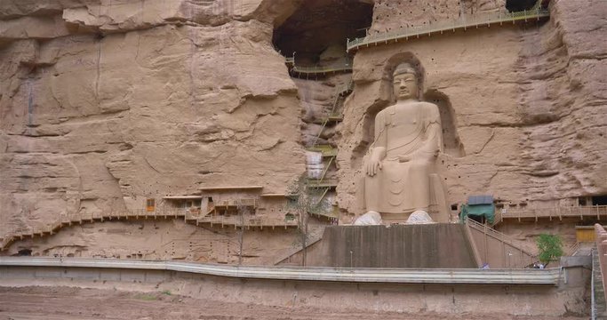Ancient Chinese Buddha Statue at Bingling Cave Temple in Gansu China. UNESCO World heritage site