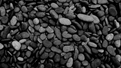 black stone background of pebble beach