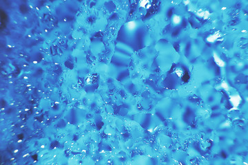 water drops on a blue background. Abstract blue background. Water drops on glass.