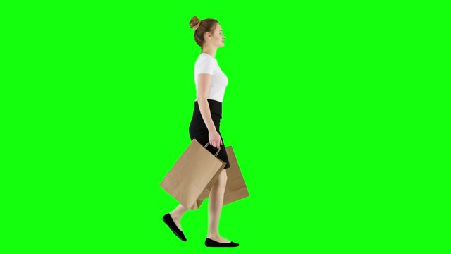 Businesswoman Walking With Shopping Bags on Green Screen