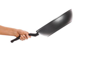 a pan in hands on a white background