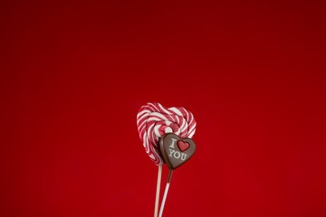 Valentines day greeting card. Handmade lollipop candy heart. Chocolate heart with the words I love...