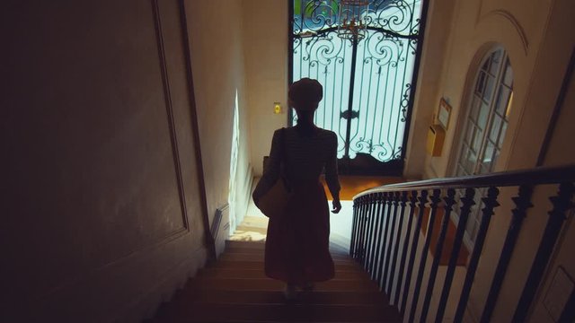 An attractive woman in the stairwell, France