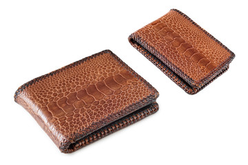 Two Brown crocodile skin wallets on white background
