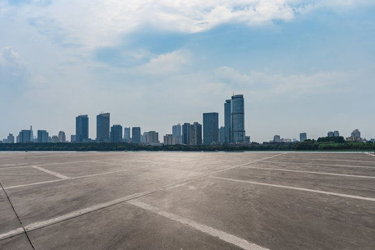 Background Material Of City And Ground Synthesis Under Blue Sky And White Clouds