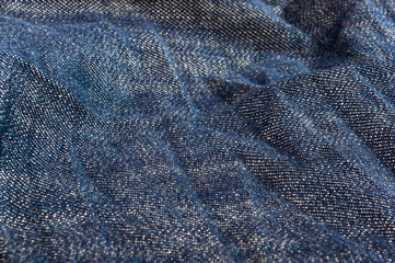clothing items blue stonewashed faded jeans cotton fabric texture with seams, clasps, buttons and...