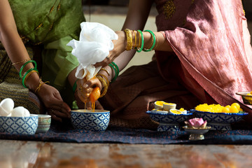 Thai women  make Thai dessert. Yellowfin and Foi Thong Thai desserts are made of duck, flour and sugar.