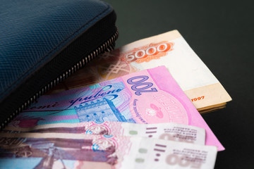 Blue wallet full of money