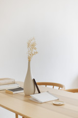 white vase on wood table bright cozy interior