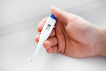 Thermometer in a Hand