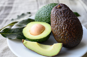 Fresh ripe green and brown avocados ready to eat