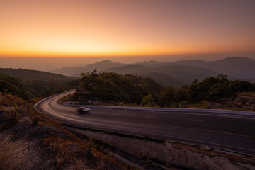 Sunset with Long Exposure Car light trails at Doi Inthanon National Park Viewpoint, Chiang Mai, Thailand