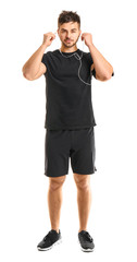 Fototapeta premium Sporty young man on white background