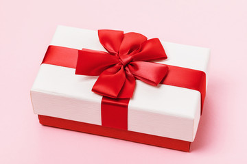 Gift box on a pink background, close-up. Holiday concept