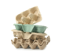 Cardboard boxes for eggs on white background. Recycling concept