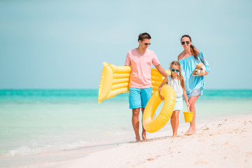 Happy beautiful family with kids on the beach