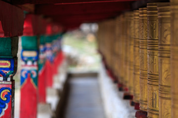 Fototapeta na wymiar Tibetan prayer wheels with shallow depth of field