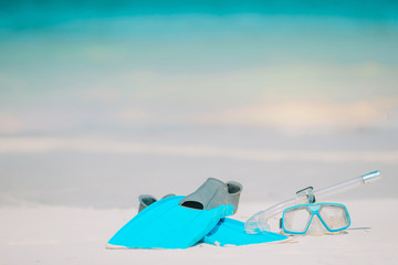Fototapeta na wymiar Snorkeling equipment mask, snorkel and fins on white beach