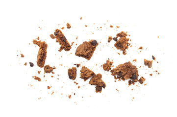 Cookies broken and crumbs of chocolate chip flavored isolated on white background.