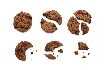 Chocolate chip cookies with some broken and crumbs isolated on white background in Top view.