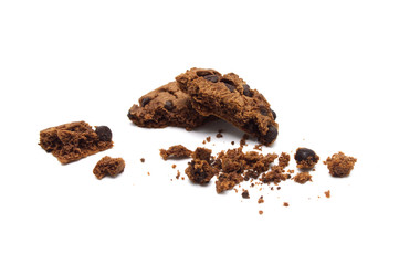 Chocolate chip cookies with some broken and crumbs isolated on white background.