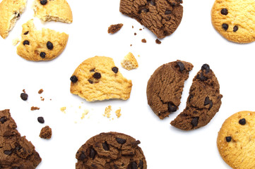 Chocolate chip cookies with some broken and crumbs isolated on white background in Top view.