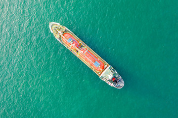 Aerial top view of the ship carrying the lpg and oil tanker in the sea port. For energy export and import business for transportation