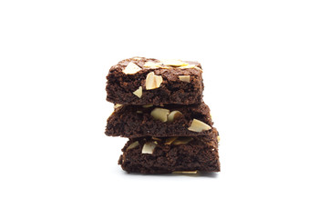 Pile of chocolate brownies with sliced almond nuts toppings isolated on white background.