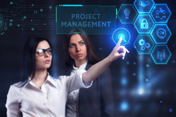 Business, Technology, Internet and network concept. Young businessman working on a virtual screen of the future and sees the inscription: Project management