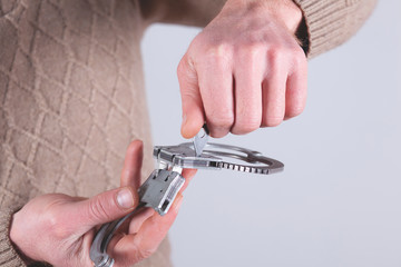 man hand handcuffs