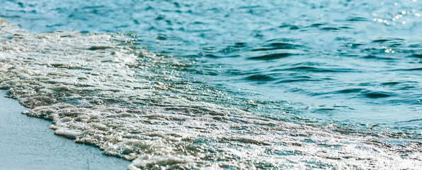 Summer sea and beautiful beach of Kazakhstan. Blue waves, Sunset, storm, hello summer.