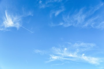 Light blue sky with cirrocumulus clouds. Beautiful sky background - obrazy, fototapety, plakaty