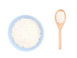 Fototapeta na wymiar Indian long grain Basmati rice in blue ceramic bowl and wooden spoon isolated on white. Indian cuisine, ayurveda, naturopathy concept